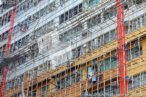 Image of bamboo scaffolding of repairing old building