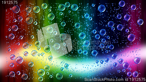 Image of Cheerful colors of raindrops on the window