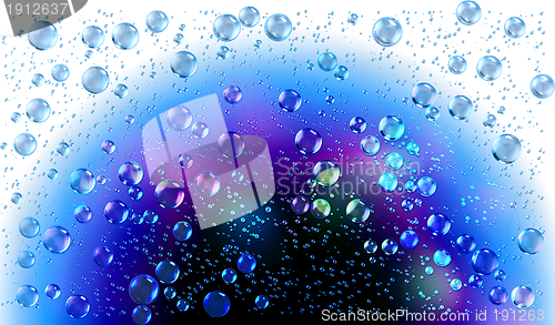 Image of Cheerful colors of raindrops on the window