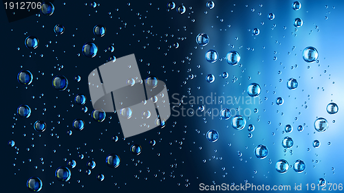 Image of motion blue water drops in the rain