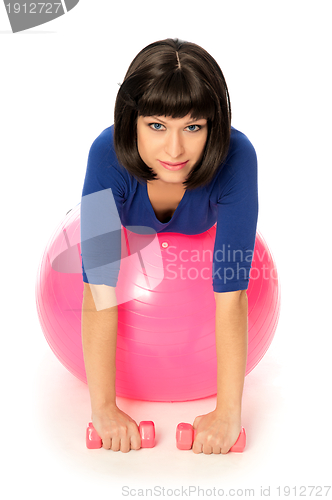 Image of Exercises with dumbbells on a gymnastic ball