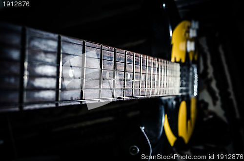 Image of electric guitar with light reflec