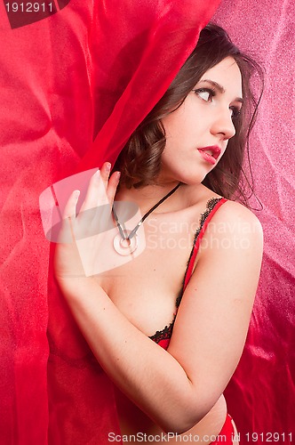 Image of young woman in red lingerie