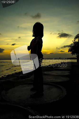 Image of Silhouette of a Kid with Sunset