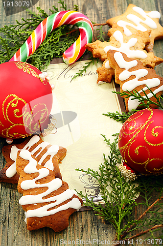 Image of Christmas balls, gingerbread and candy cane.
