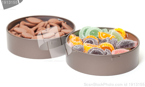 Image of Colorful Jelly and Chocolate Candies in tin cans