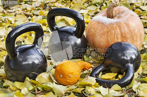 Image of iron  kettlebells outdoors