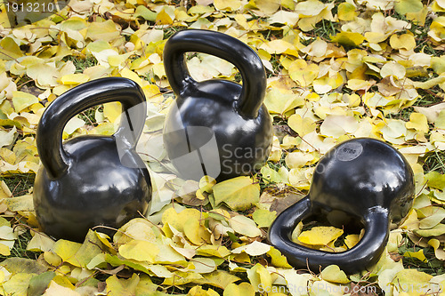 Image of iron  kettlebells outdoors