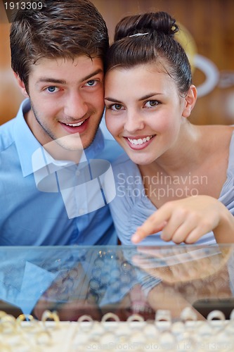 Image of happy young couple in jewelry store