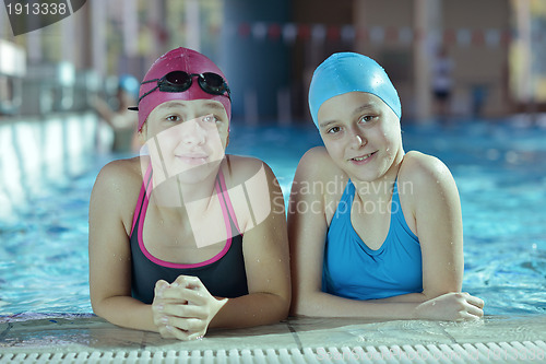 Image of happy childrens at swimming pool