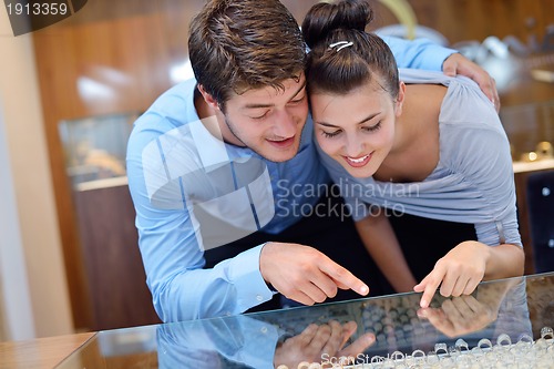 Image of happy young couple in jewelry store