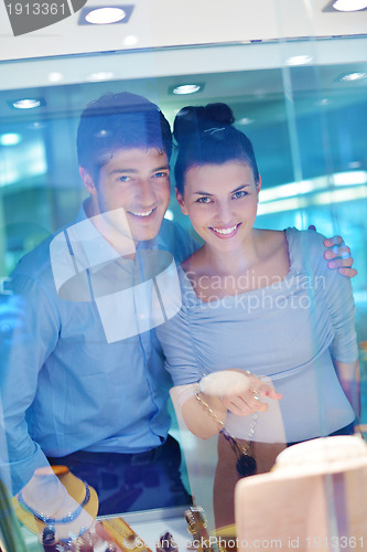 Image of happy young couple in jewelry store