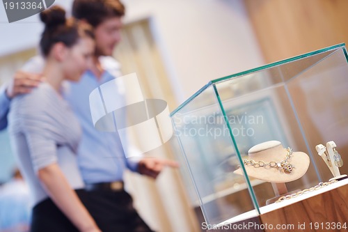 Image of happy young couple in jewelry store