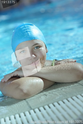 Image of happy child on swimming pool