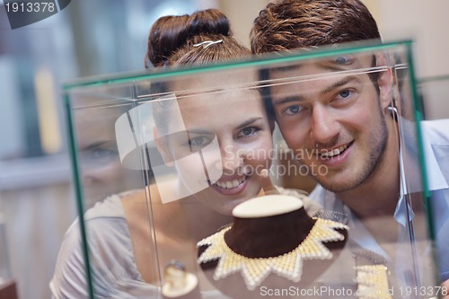 Image of happy young couple in jewelry store
