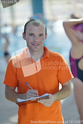 Image of happy childrens at swimming pool