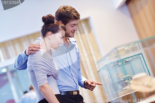 Image of happy young couple in jewelry store