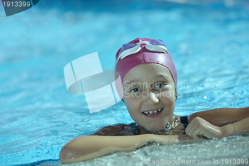 Image of happy child on swimming pool