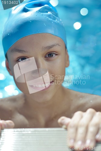 Image of happy child on swimming pool