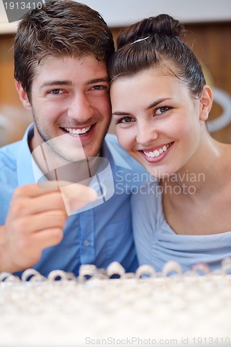 Image of happy young couple in jewelry store