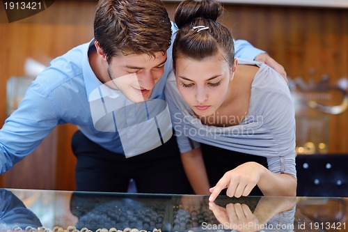 Image of happy young couple in jewelry store