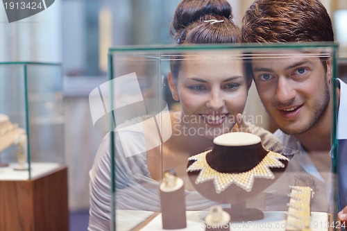 Image of happy young couple in jewelry store