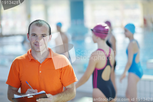 Image of happy childrens at swimming pool