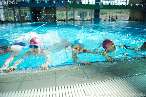 Image of happy childrens at swimming pool