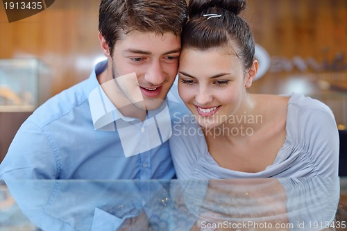 Image of happy young couple in jewelry store