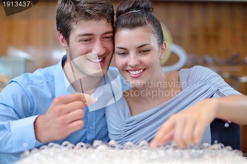 Image of happy young couple in jewelry store