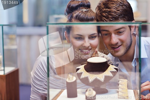 Image of happy young couple in jewelry store