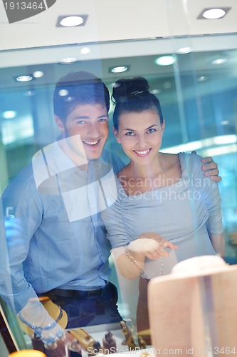 Image of happy young couple in jewelry store