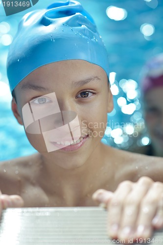 Image of happy child on swimming pool