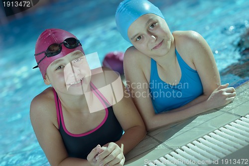 Image of happy childrens at swimming pool