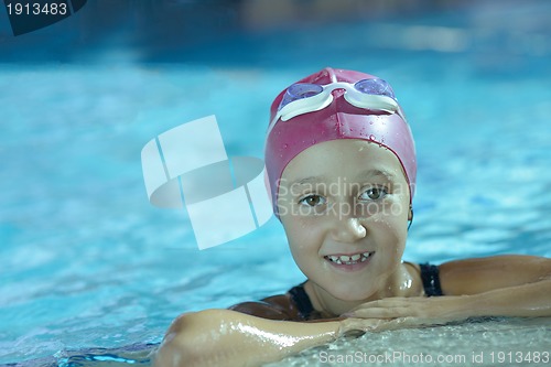 Image of happy child on swimming pool