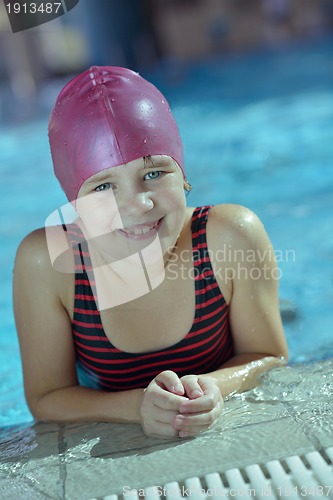 Image of happy child on swimming pool