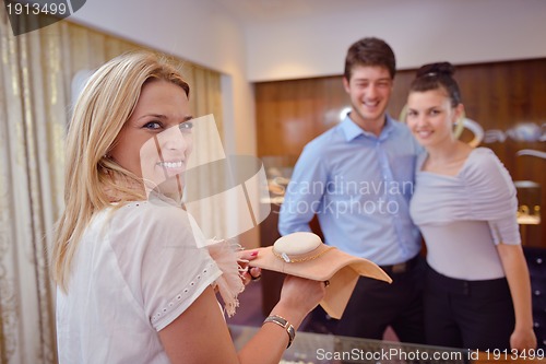 Image of happy young couple in jewelry store