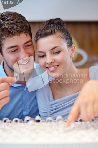 Image of happy young couple in jewelry store