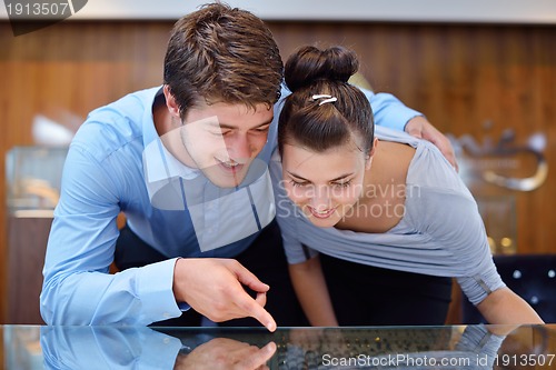Image of happy young couple in jewelry store