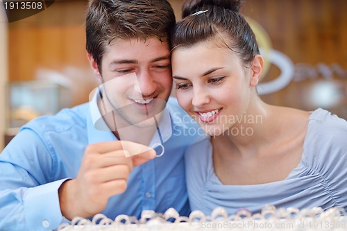 Image of happy young couple in jewelry store