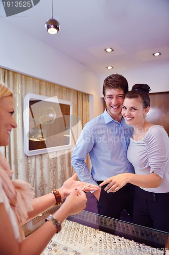 Image of happy young couple in jewelry store