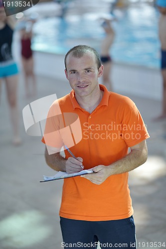 Image of happy childrens at swimming pool