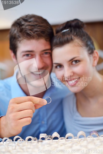 Image of happy young couple in jewelry store
