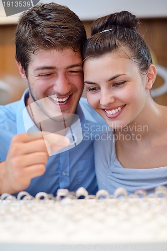 Image of happy young couple in jewelry store