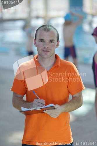 Image of happy childrens at swimming pool