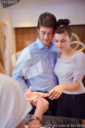 Image of happy young couple in jewelry store