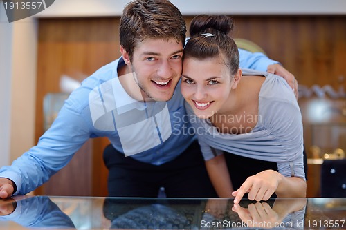 Image of happy young couple in jewelry store