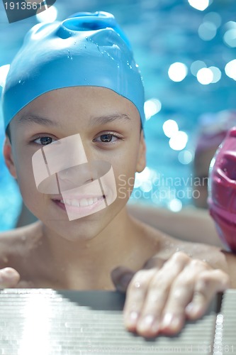 Image of happy child on swimming pool