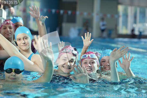 Image of happy childrens at swimming pool