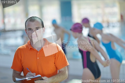 Image of happy childrens at swimming pool